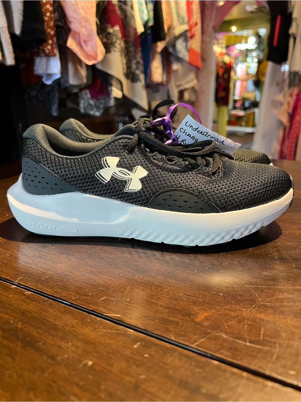 Under Armour Women’s charged surge  Black Athletic Shoes with White Logo